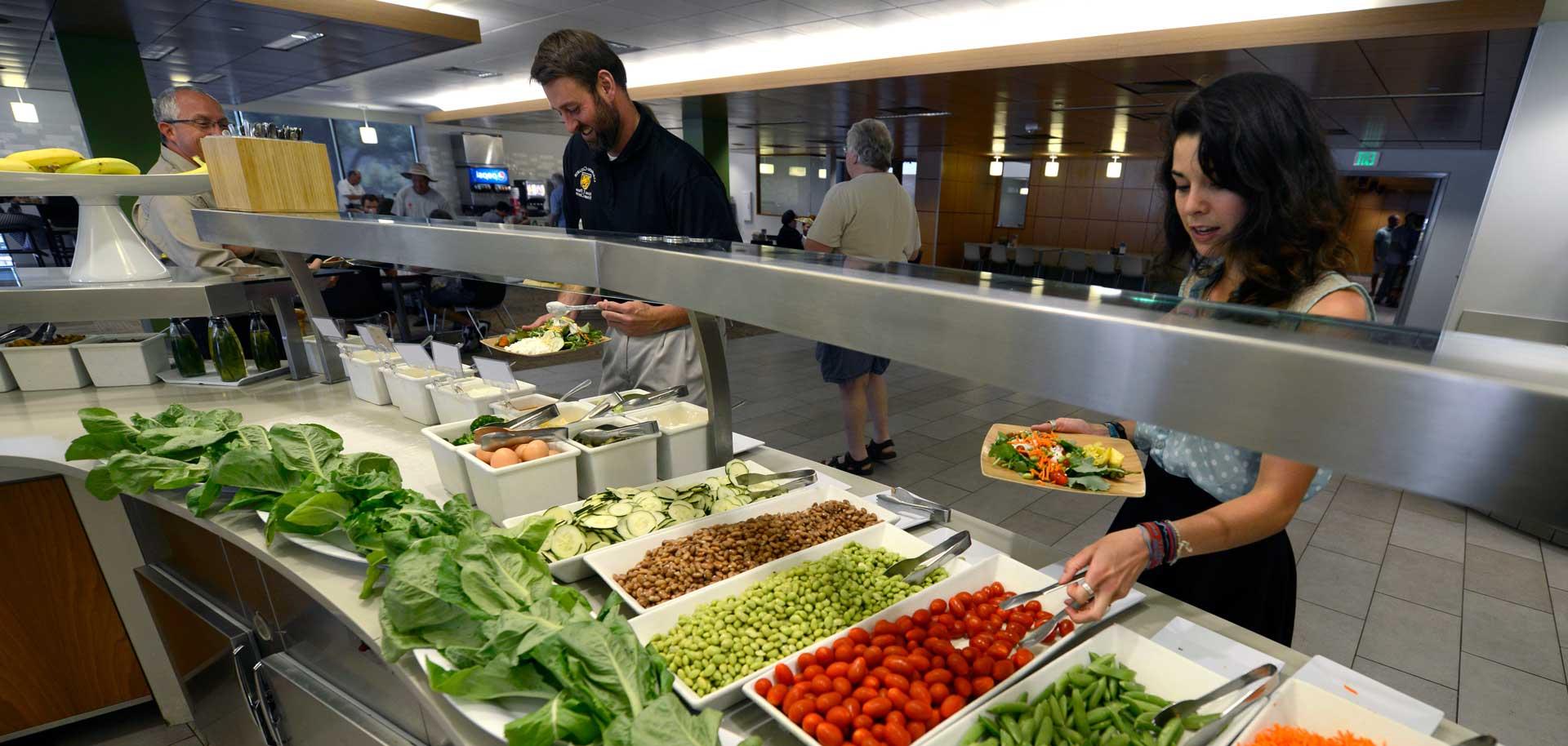 Students, faculty, staff and visitors flock to CC's cafeteria, Rastall Cafe. Some produce at the salad bar is harvested from the student garden. 
